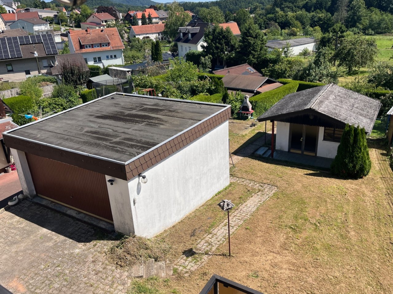 IMG Grundstück mit Garage und Gartenhaus